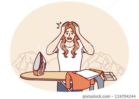 Housewife woman ironing clothes and clutching head in panic due to overload and fatigue 119704244