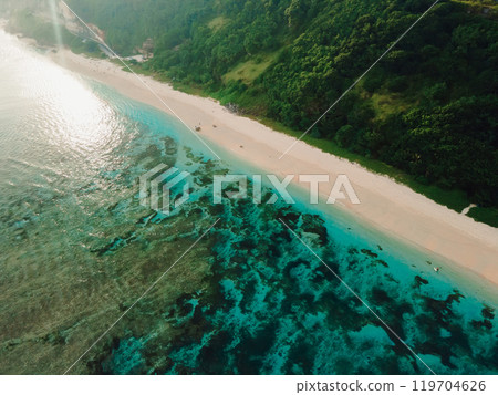 Coastline with green cliffs and ocean in Bali island. Aerial view of tropical vacation beach Coastline with green cliffs and ocean in Bali island. Aerial view of tropical vacation beach 119704626
