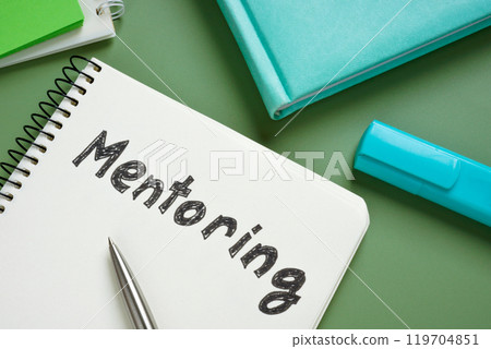 Handwritten mentoring in notebook as guidance concept. 119704851