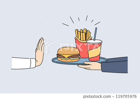 Refusal from fast food and harmful products demonstrated by hand of man, rejecting tray with burger 119705976