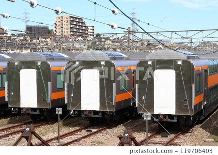 A large number of Chuo Line double-decker green cars stored at the Toyota Rolling Stock Center (Hino City, Tokyo) A large number of Chuo Line double-decker green cars stored at the Toyota Rolling Stock Center (Hino City, Tokyo) 119706403