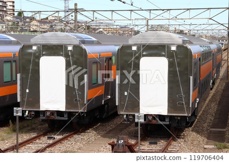 A large number of Chuo Line double-decker green cars stored at the Toyota Rolling Stock Center (Hino City, Tokyo) 119706404