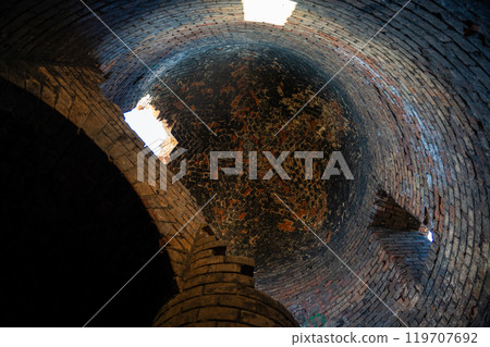 The ceiling in the brick tower of the Bobruisk fortress. Sunlight inside The ceiling in the brick tower of the Bobruisk fortress. Sunlight inside 119707692