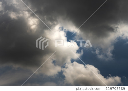 Dramatic dark storm rain clouds black sky background. Dark thunderstorm clouds rainny atmosphere. Meteorology danger windstorm disasters climate. Dark cloudscape storm disaster gloomy gray cloud sky 119708389