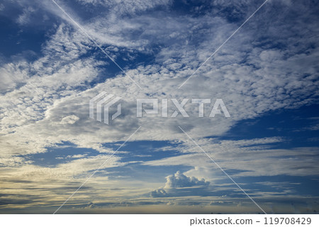 Tropical summer blue sky fluffy white cloud summertime on light sunny day cloudscape. Clear bright blue skyline spring sunlight climate background. Heaven blue environment ecology high scenic nature. Tropical summer blue sky fluffy white cloud summertime on light sunny day cloudscape. Clear bright blue skyline spring sunlight climate background. Heaven blue environment ecology high scenic nature. 119708429
