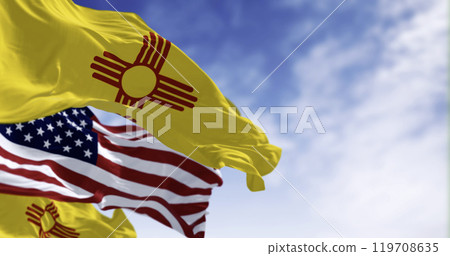 Close-up view of the New Mexico and United States flags waving 119708635
