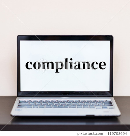 Learn about compliance through e-learning [Image of employee training] 119708694
