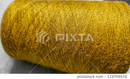 Orange threads for handicrafts. Selecting a color palette for knitting. Autumn Orange threads for handicrafts. Selecting a color palette for knitting. Autumn 119709838