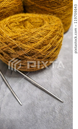 Orange threads for handicrafts. Selecting a color palette for knitting. Autumn Orange threads for handicrafts. Selecting a color palette for knitting. Autumn 119709843