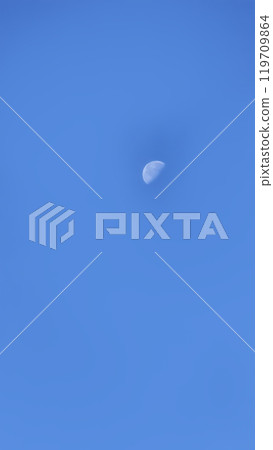 Blue sky and moon in the center, warm autumn day. Blue sky and moon in the center, warm autumn day. 119709864