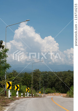 Curve marker signs are on left sign of the road. Curve marker signs are on left sign of the road. 119710233