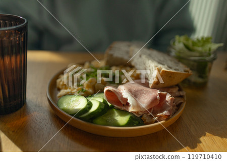 Delicious sandwiches with eggs, ham and cucumbers served on buffet table for brunch Delicious sandwiches with eggs, ham and cucumbers served on buffet table for brunch 119710410