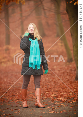 Girl is walking through the park. 119710521