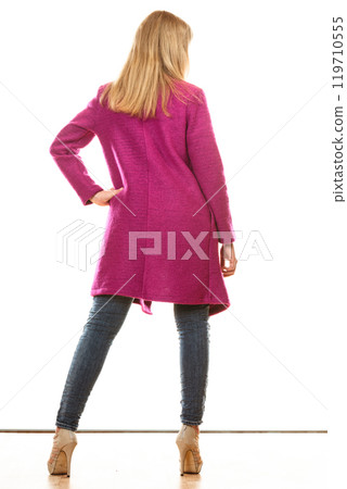 blonde fashionable woman in vivid color coat. 119710555