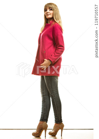 Full length fashion woman in red coat. 119710557