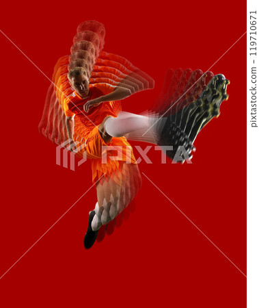 High-energy soccer action collage featuring male athlete in motion, captured mid-kick against vibrant red background. High-energy soccer action collage featuring male athlete in motion, captured mid-kick against vibrant red background. 119710671