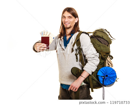 Man tourist backpacker holding money and passport. Man tourist backpacker holding money and passport. 119710733