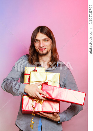 Guy with many presents gift boxes 119710763