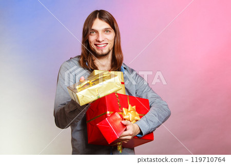 Guy with many presents gift boxes 119710764