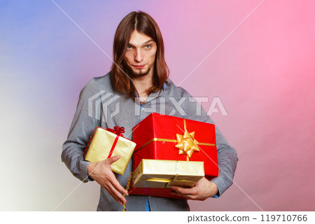 Guy with many presents gift boxes 119710766