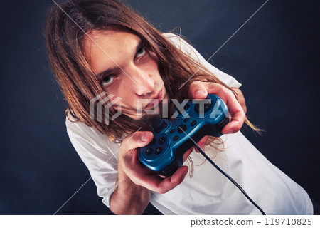Male player focus on play games Male player focus on play games 119710825