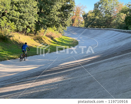 man riding bicycle on curve race track in Monza 119710916