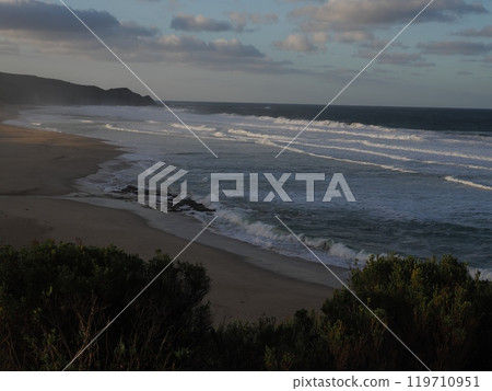 Waves illuminated by the morning sun Johanna Beach Victoria Australia 119710951