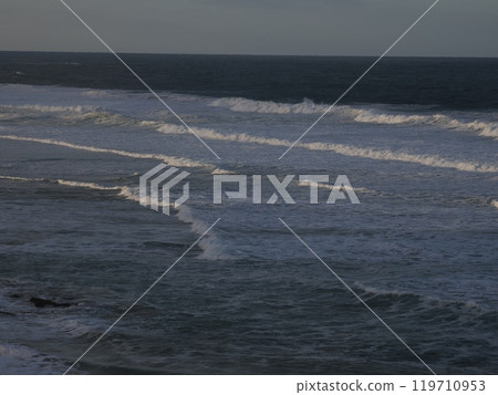 Waves illuminated by the morning sun Johanna Beach Victoria Australia 119710953