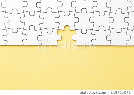 Plain jigsaw puzzle on a yellow background 119711071