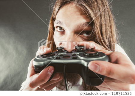 Male player focus on play games 119711525