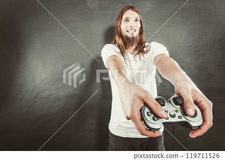 Happy man playing games Happy man playing games 119711526