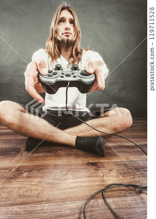 Male player focus on play games 119711528