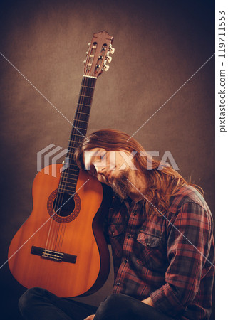 Languorous young man with instrument. 119711553