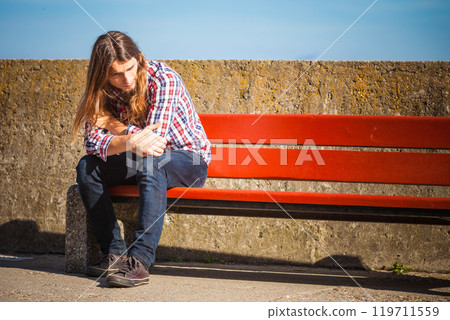 Man outdoor concerned and stressed 119711559