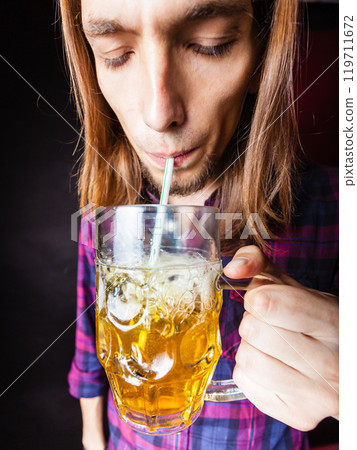 Young man drinking pint. Young man drinking pint. 119711672