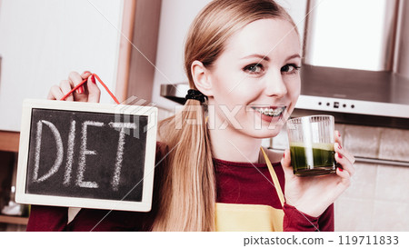Woman holding vegetable juice and diet sign 119711833