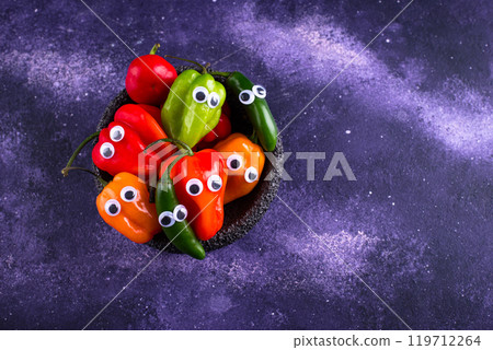 Cute color bell pepper with eyes. 119712264