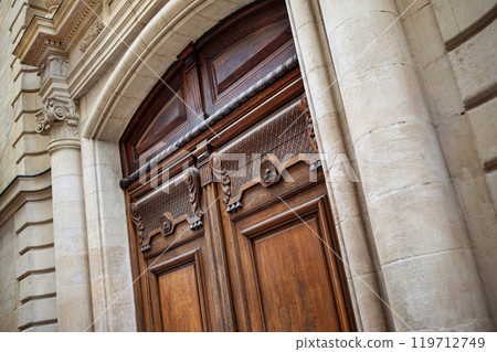 Facade of a French stone mansion 119712749