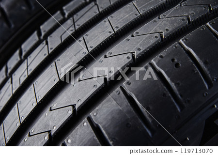 Close up on new summer tire with tread pattern Close up on new summer tire with tread pattern 119713070