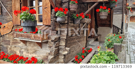Most beautiful Swiss villages - pretty Griementz with traditional wooden houses and floral streets. popular tourist attraction in Valais Canton of Switzerland 119713369