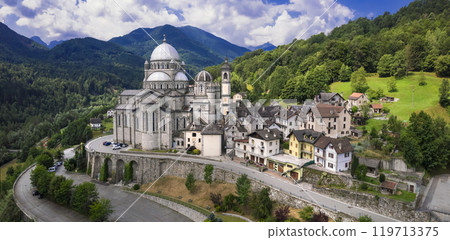 Piedmont, Italy .majestic Sanctuary of Madonna del Sangue, Sanctuary of Re - scenic village . famous places of worship. aerial panoramic view 119713375