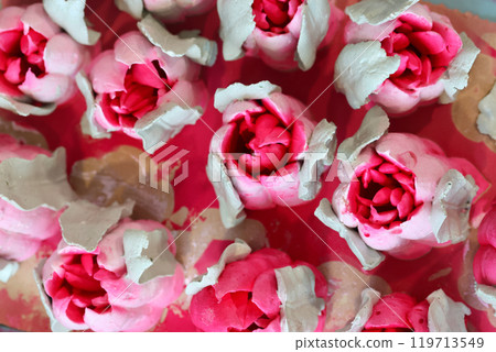 Bright pink marshmallow tulips. Marshmallow flowers. Spread out on the table surface. Bright pink marshmallow tulips. Marshmallow flowers. Spread out on the table surface. 119713549
