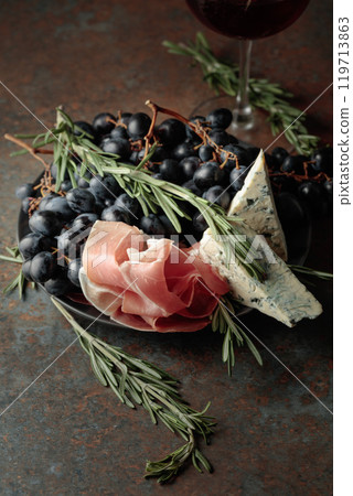 Red wine with grapes, rosemary, prosciutto, and blue cheese. Red wine with grapes, rosemary, prosciutto, and blue cheese. 119713863