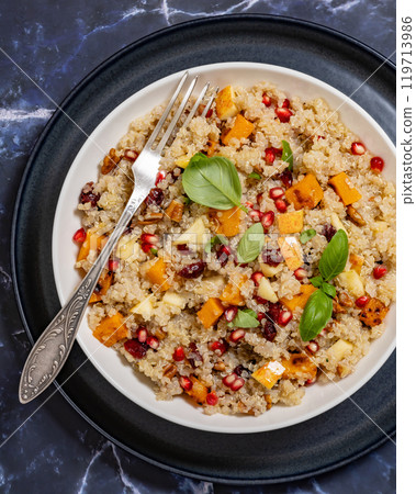 winter quinoa salad with roasted squash in a bowl 119713986