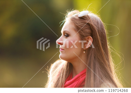 Portrait girl relaxing walking in autumnal park. Portrait girl relaxing walking in autumnal park. 119714268