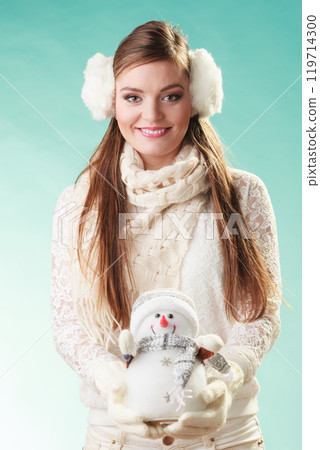 Smiling cute woman with little snowman. Winter. 119714300