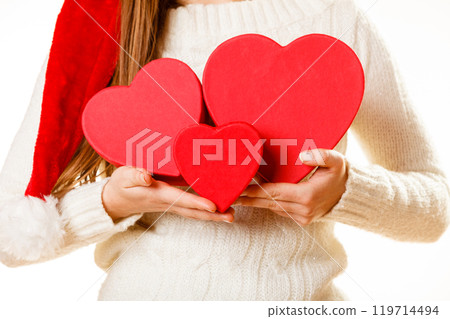 Girl holding cute hearts. Girl holding cute hearts. 119714494
