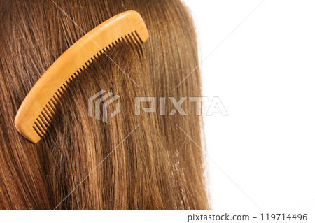 Haircare. Brown hair with comb. Haircare. Brown hair with comb. 119714496