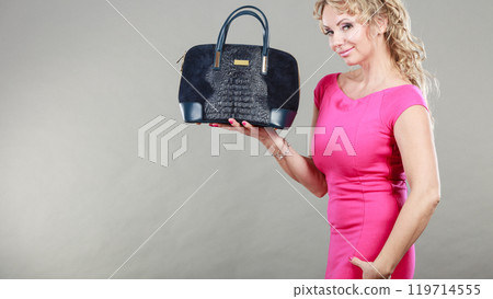 Elegant woman buyer with black bag. 119714555