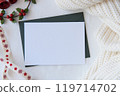 Christmas Card Mockup with Pine Branches and Holly, Cozy Holiday Scene 119714702